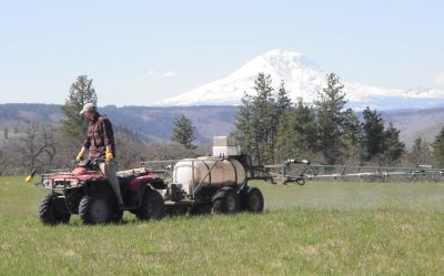 Fertilizing our hay early in the season.